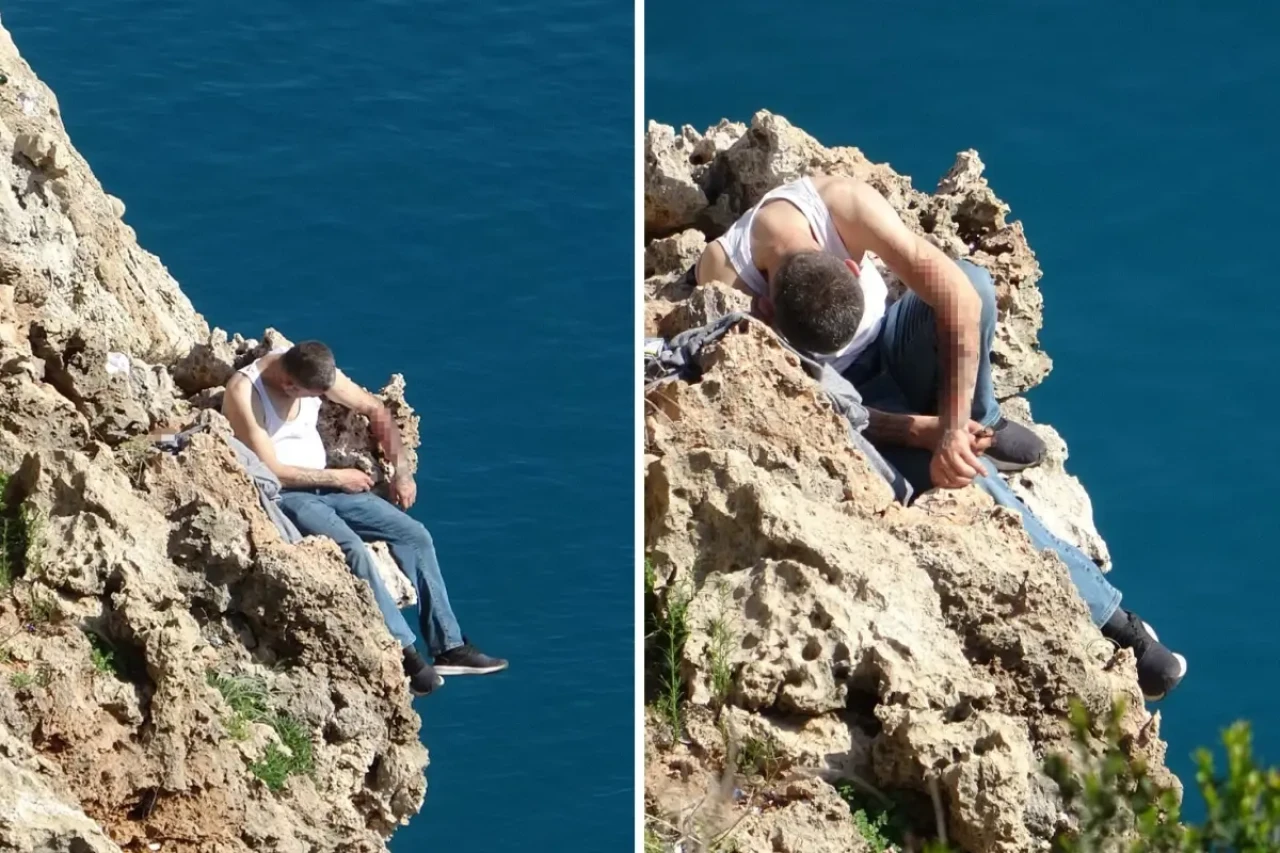 Falezlerin ucuna oturup kendini kesti, polis son anda yetişti!
